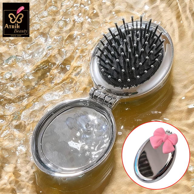 Oval Compact Mirror with Integrated Brush